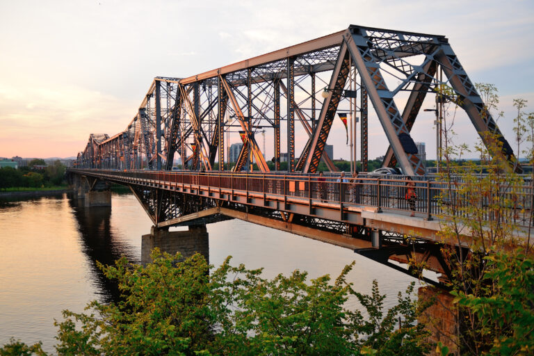 Ottawa, CANADA - SEP 8: Alexandra Bridge over river on September 8, 2012 in Ottawa, Canada. Constructed between 1898 and 1900, it's main cantilever centre span was, the longest in Canada and the fourth longest in the world.