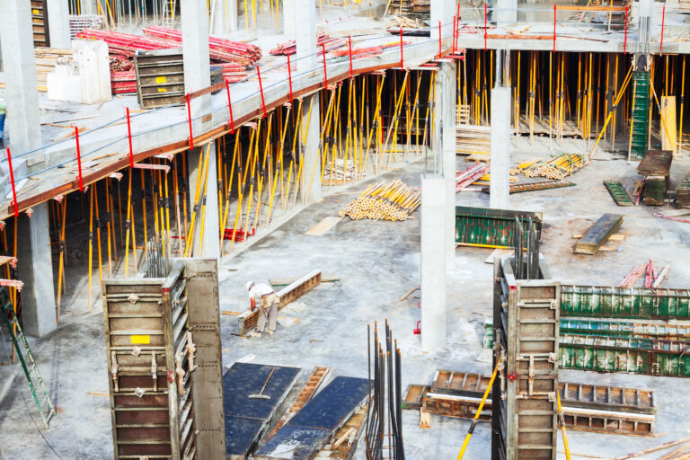 View of construction work site. Building new concrete house in summer